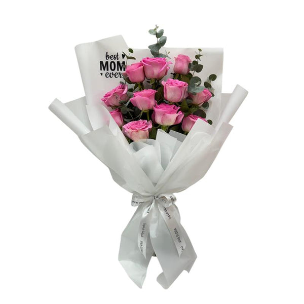 Beautiful pink rose bouquet wrapped in white with "Best Mom Ever" message.