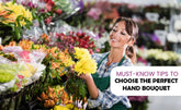 A florist is carefully selecting the perfect flowers for a wedding