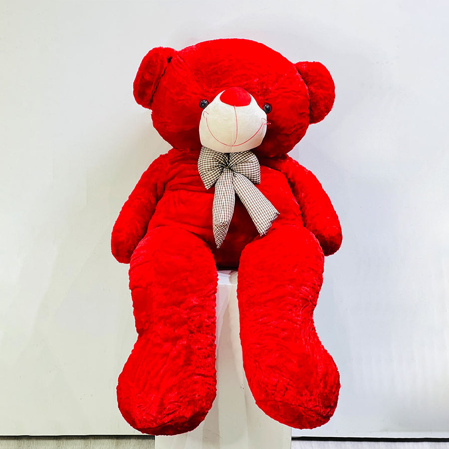 Large red teddy bear with a white nose and bow tie on a white background available in Tawar mall viva flora branch and online delivery also available.