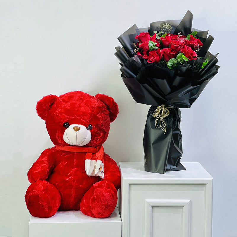 Red teddy bear and bouquet of red roses on a white surface prefect gift for love proposal, birthday and anniversary