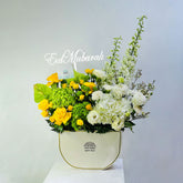 Luxury Eid flower arrangement with yellow roses, green hydrangeas, and white flowers in Viva Flora box in Qatar