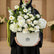 Floral arrangement in a decorative box with 'VIVA FLORA' branding on a light gray background