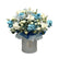 A beautiful blue and white floral arrangement in a hatbox with a "Baby Boy" topper, perfect for welcoming a newborn.