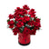 A red box accented with butterflies filled witth red roses and eucalyptus.