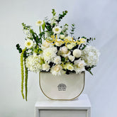 Elegant white Eid flower arrangement with roses and hydrangeas in luxury Viva Flora flower box
