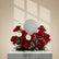 Flower arrangement with red roses, white gerberas