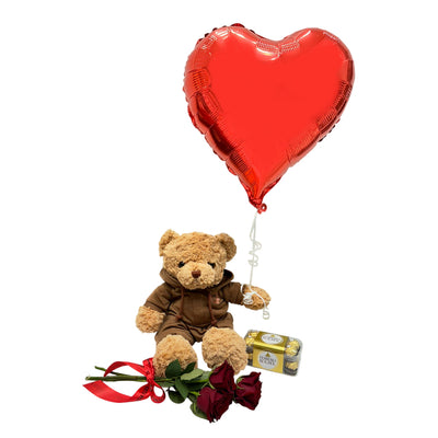 Gift set featuring a teddy bear, red heart-shaped balloon, red roses, and a box of chocolates