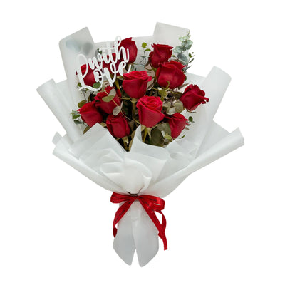 A stunning red rose bouquet featuring the word 'LOVE'—the perfect gift to express your deepest feelings.