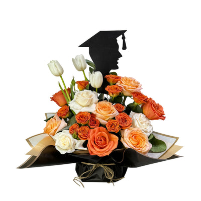 Orange and white flowers with  silhouette of a graduate boy topper