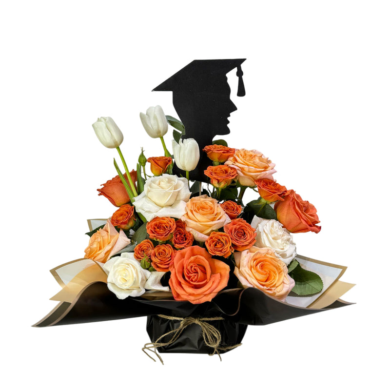 Orange and white flowers with  silhouette of a graduate boy topper