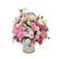 An opulent pink box with roses, hydrangeas, lilies, gerberas, and orchids.