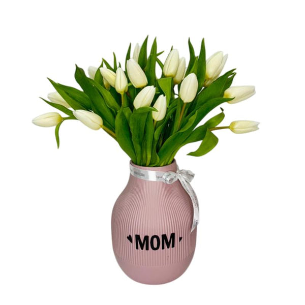 Fresh white tulips in a pink MOM vase