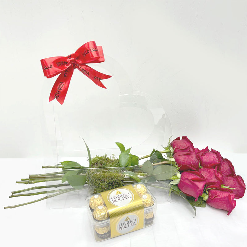 A romantic set featuring red roses, Ferrero Rocher chocolates, in a transparent balloon with a red ribbon.