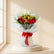 perfect hand bouquet with red roses and transparent wrapping in beige colour background  