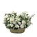 A basket overflowing with white roses, lilies, and other delicate blooms, perfect for sympathy or condolence arrangements.