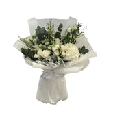  white flower bouquet with roses, hydrangeas, and greenery.