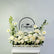 Floral arrangement with 'Congrats!' sign on a light gray background