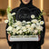 Floral arrangement with 'Congrats!' sign on a light gray background