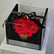 Heart-shaped arrangement of red roses in a clear box with a black ribbon, branded 'Viva Flora' perfect gift for your loved once in qatar