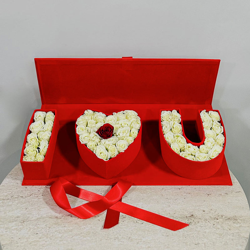 Red box with 'I LOVE YOU' made of white roses and perfect gifting option on valentines day