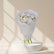 A bouquet of pale pink and white peony flowers wrapped in translucent white paper with a pink tissue lining and pink ribbon, photographed against a soft light gray background.