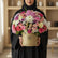 Colorful flower arrangement in a beige box with 'VIVA FLORE' branding on a white surface.
