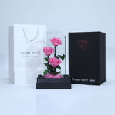 Luxury arrangement of three pink preserved roses for gifting in Qatar
