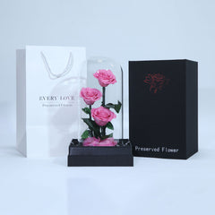 Luxury arrangement of three pink preserved roses for gifting in Qatar