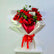 A bouquet of red roses wrapped in white paper with a red ribbon bow, displayed on a white pedestal against a plain light background.