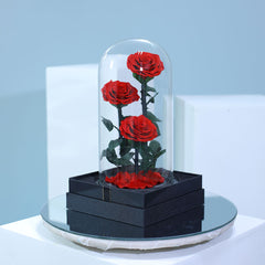 Three preserved red roses arranged beautifully for romantic gifting in Qatar