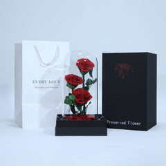 Three preserved red roses arranged beautifully for romantic gifting in Qatar