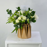 white_flower_arrangement_with_white_roses_and_mixed_flowers 