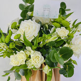 white_flower_arrangement_with_white_roses_and_mixed_flowers 