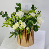 white_flower_arrangement_with_white_roses_and_mixed_flowers 