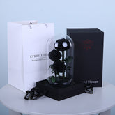 Luxury arrangement of three black preserved roses with elegant wrapping in Qatar