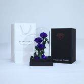 Elegant arrangement of three blue preserved roses in luxury wrapping for gifting in Qatar