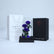 Elegant arrangement of three blue preserved roses in luxury wrapping for gifting in Qatar